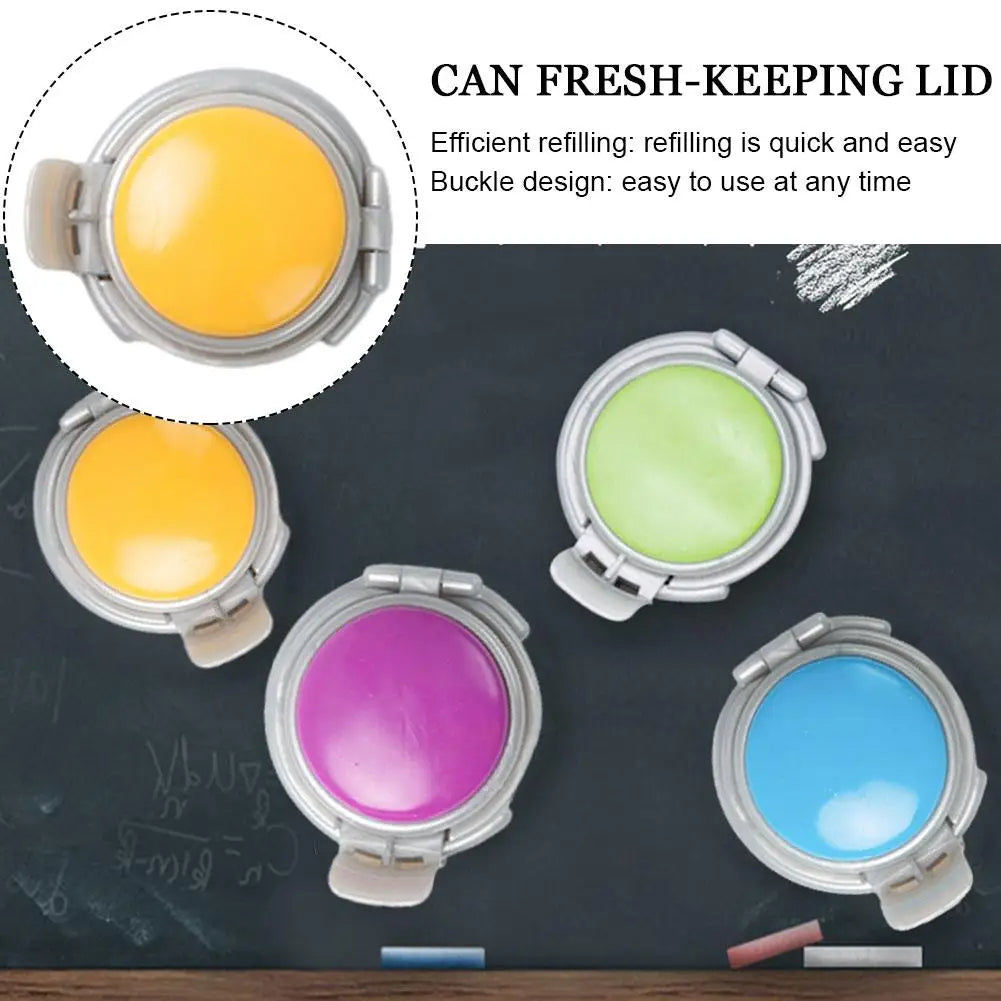 Colorful can fresh-keeping lids on a blackboard background