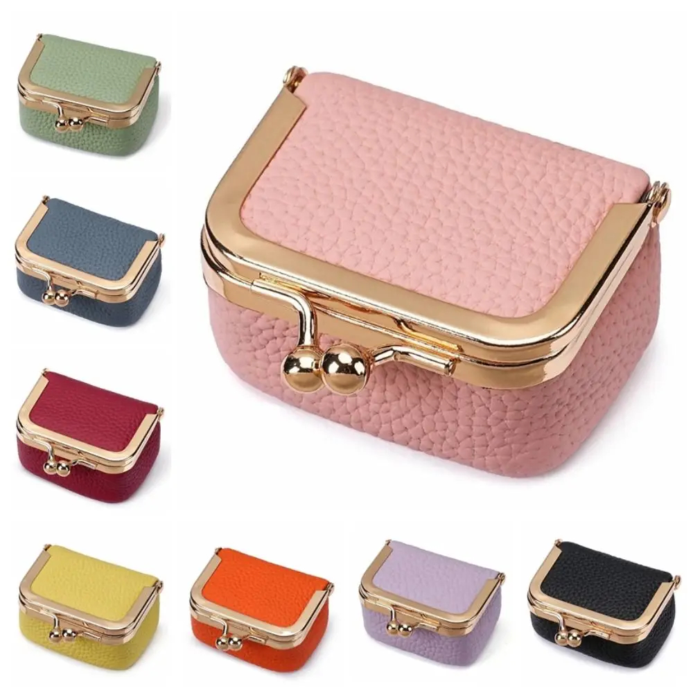 Set of small, colorful jewelry boxes with gold clasps on a white background