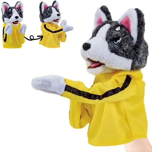 A plush dog puppet hand puppet with a gray and white fur face, pink inner ears, blue eyes, and a bright yellow sleeveless top with a black stripe, shown on a white background. Two smaller inset views at the upper left show the hand puppet closed, and a small portion of a human hand is visible at the lower right holding the puppet.