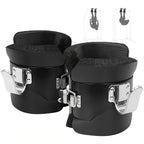 Pair of black knee pads with metal straps on a white background