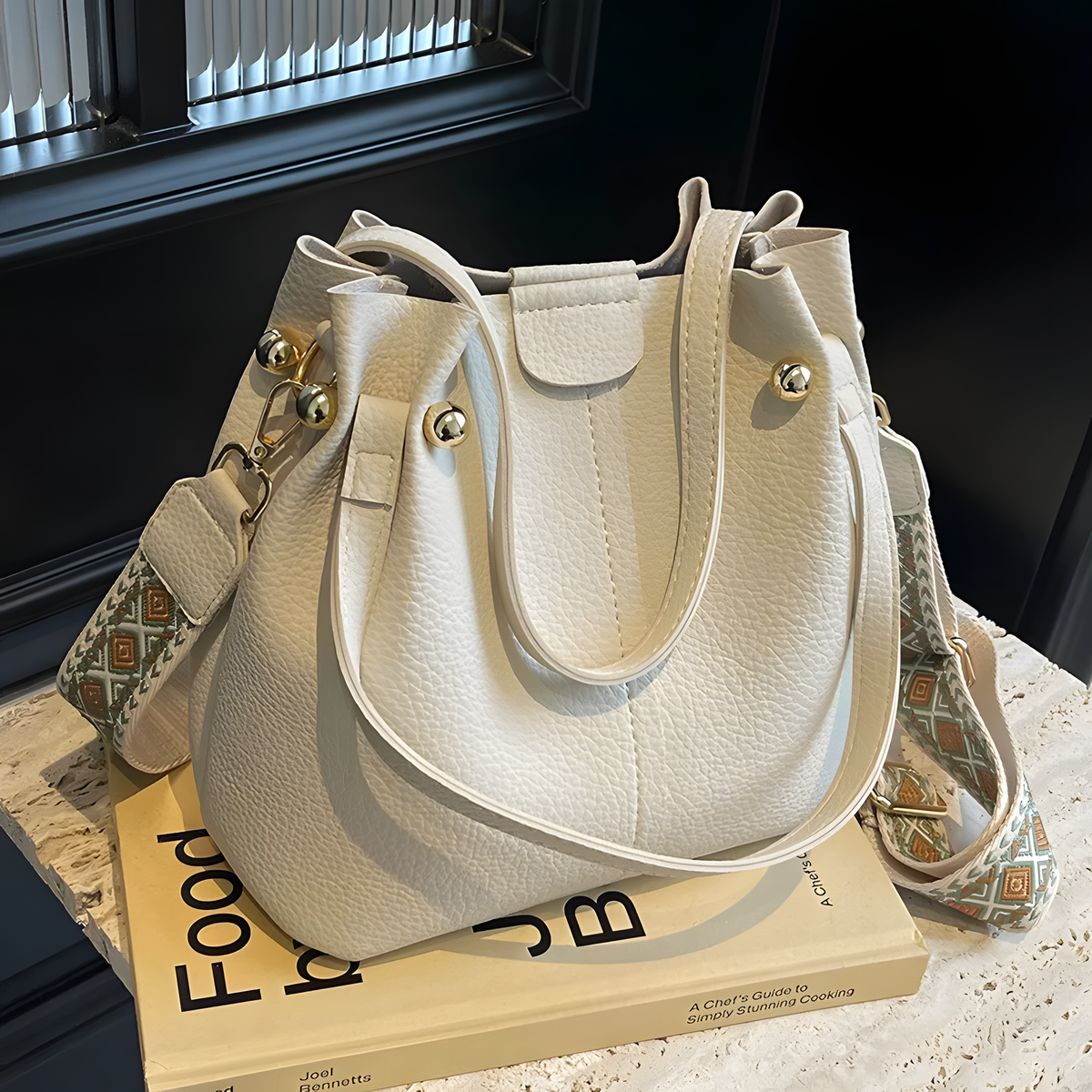 Compact Bucket Handbag with Wide Patterned Shoulder Strap