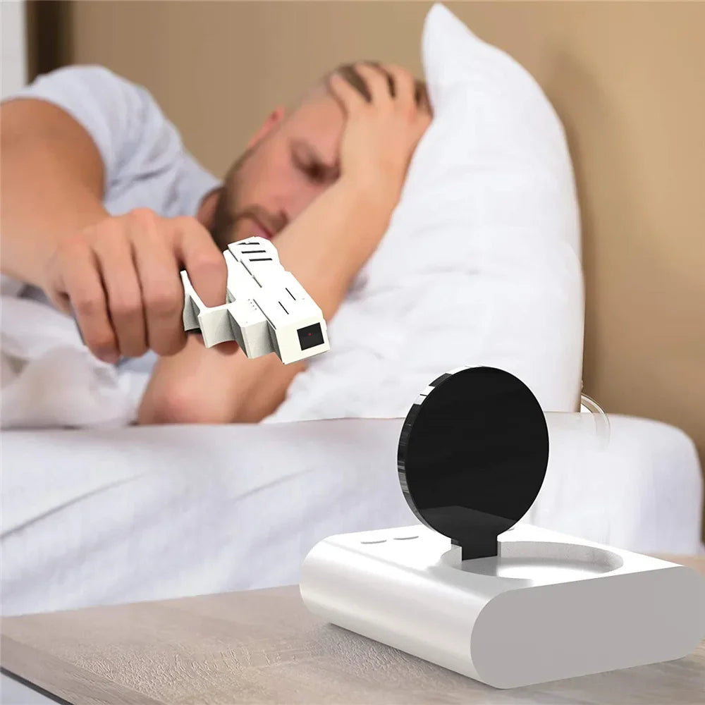Person using a remote control to operate a device on a nightstand.