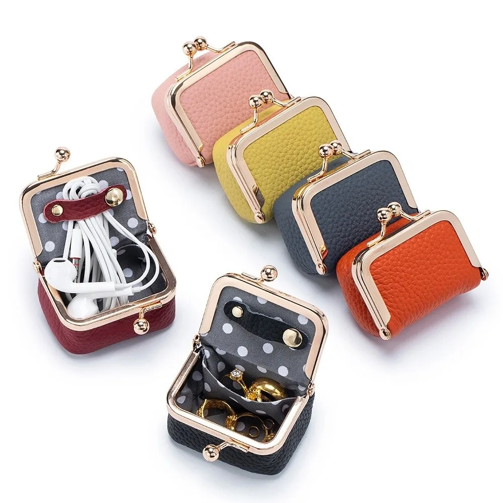 Set of colorful small purses with gold clasps on a white background