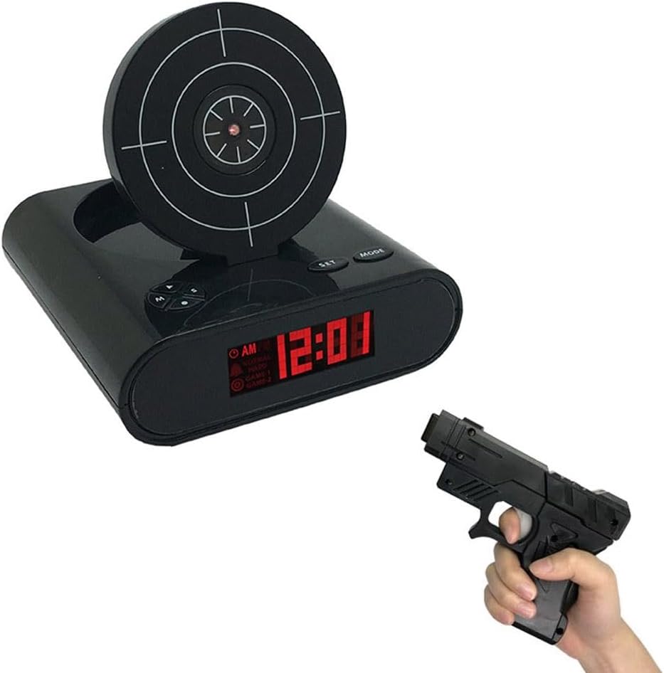 Black alarm clock with digital display and target design, held by a hand with a toy gun.
