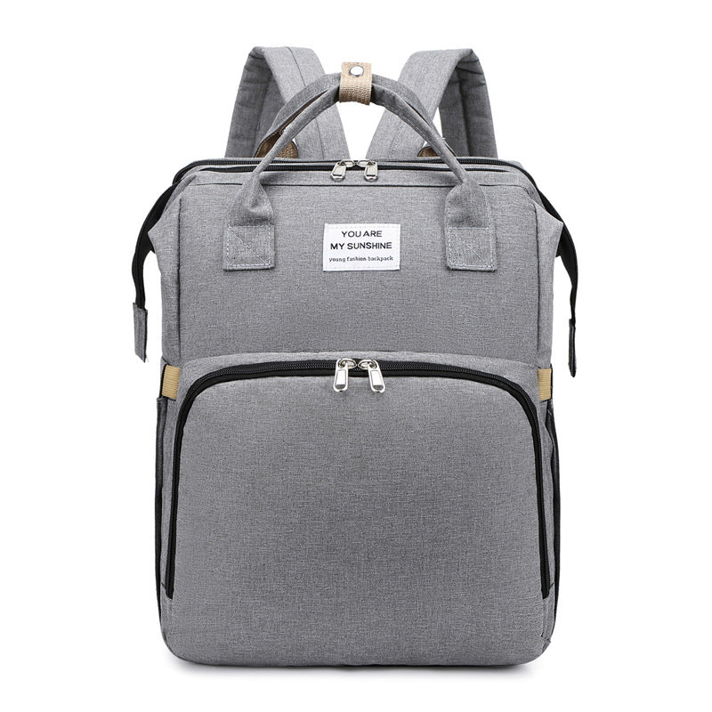 Gray backpack with a visible brand label on a white background