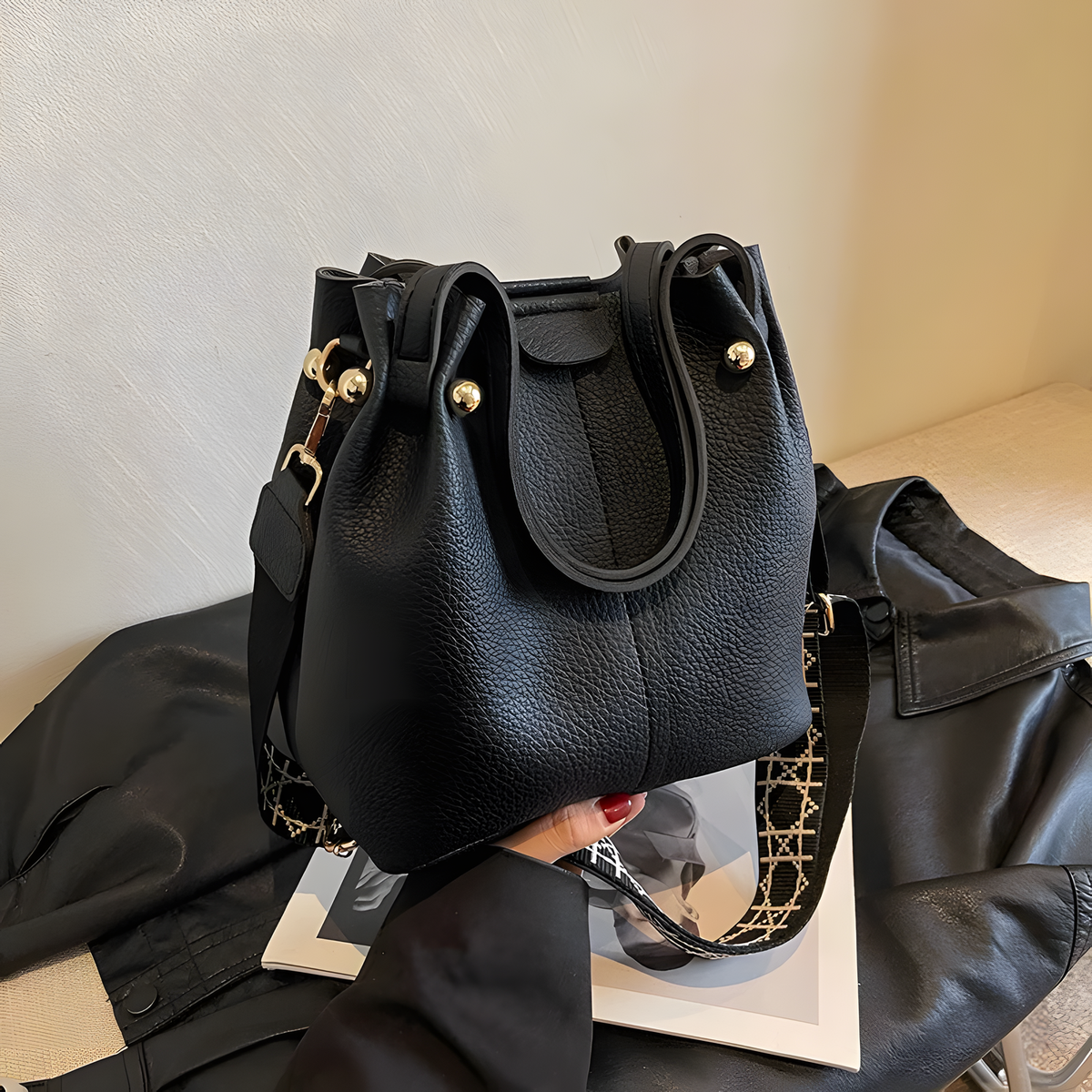 Compact Bucket Handbag with Wide Patterned Shoulder Strap