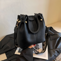 Compact Bucket Handbag with Wide Patterned Shoulder Strap