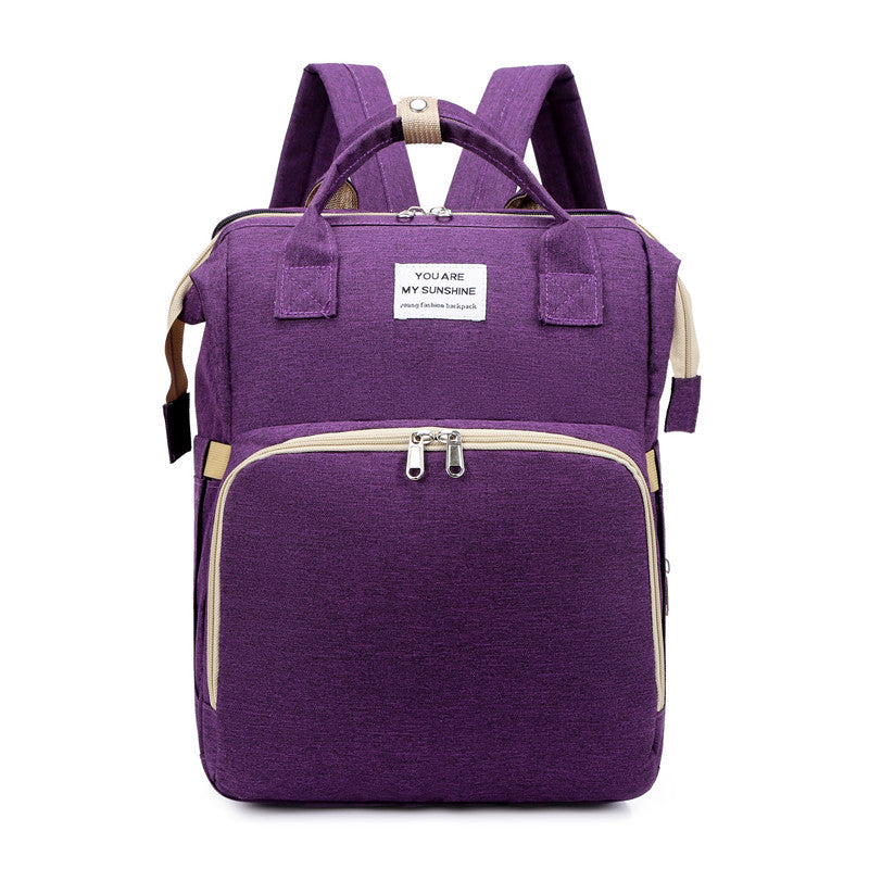 Purple backpack with beige accents on a white background