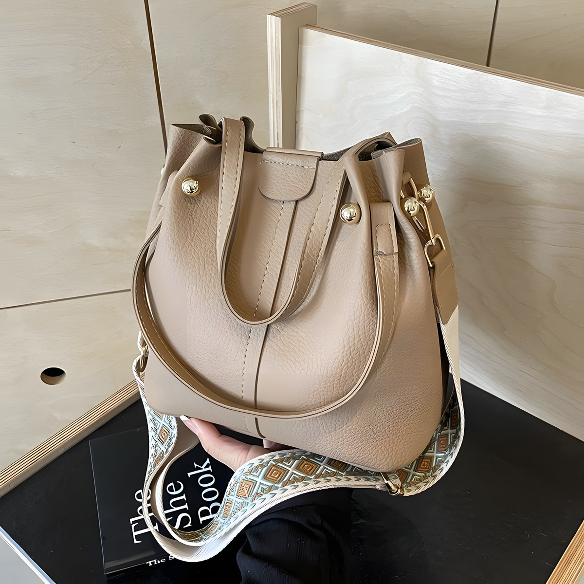 Compact Bucket Handbag with Wide Patterned Shoulder Strap
