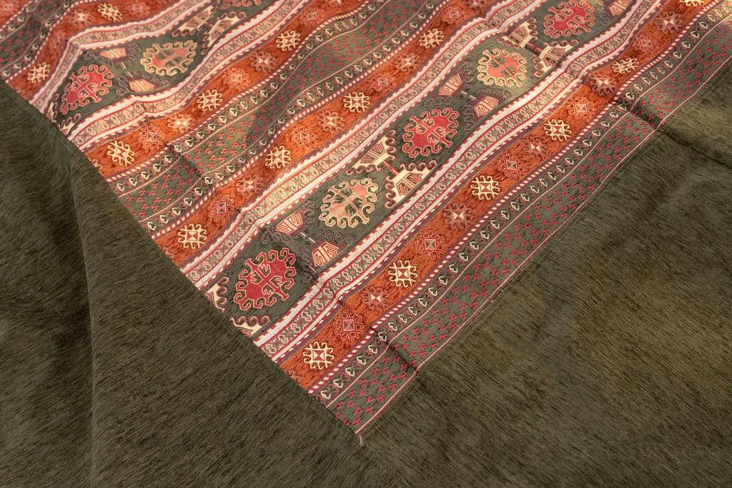 Olive Turkish rug with wide plain border and rust, red and beige geometric stripe panel