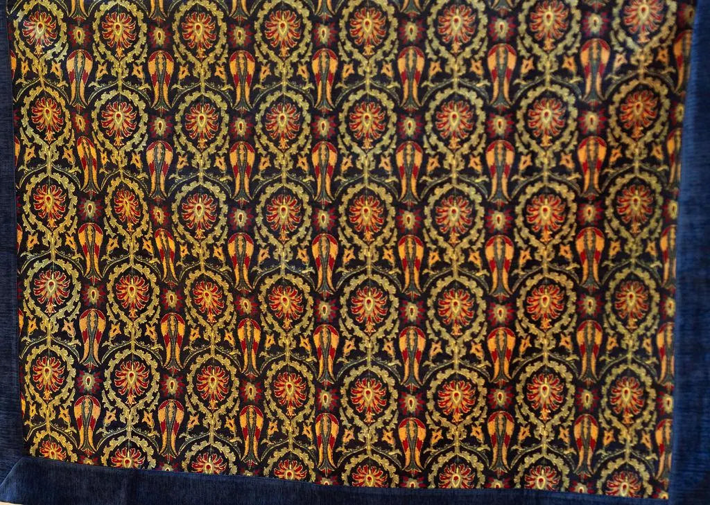 Square navy Turkish rug with repeating red and gold-tone floral motifs and broad blue border